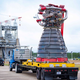 The engine, designated E10001, being delivered to the test stand at Stennis